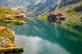 Unidentified tourists enjoy the sights of Balea Lake at 2,034 m altitude in Fagaras Mountains Royalty Free Stock Photo