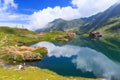 Unidentified tourists enjoy the sights of Balea Lake at 2,034 m altitude on July 21 Royalty Free Stock Photo