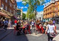 Unidentified tourists and locals at South Kensington area at summer day near Casa Brindisa restaurant