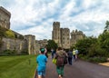 Unidentified tourists near medieval buildings inside Windsor Castle