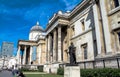 Unidentified tourists near National Gallery in Trafalgar Square, London . UK Royalty Free Stock Photo