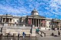 Unidentified tourists near National Gallery in Trafalgar Square, London . UK Royalty Free Stock Photo