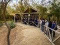 Unidentified Tourists near the Sacred water of the River Jordan Royalty Free Stock Photo