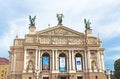 Unidentified tourists near theatre in Lviv, Ukraine