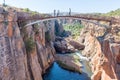 Unidentified tourists on a pedestrian bridge at Bourkes Luck Potholes Royalty Free Stock Photo