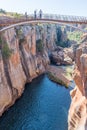 Unidentified tourists on a pedestrian bridge at Bourkes Luck Potholes Royalty Free Stock Photo