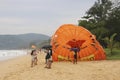 Unidentified tourists prepare for parasailing on Karon beach, Phuket, Thailand