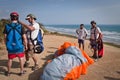 Unidentified tourists preparing to paraglide over