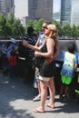 Unidentified tourists taking selfie at the National 911 Memorial at Ground Zero