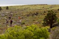 Unidentified tourists trekking in an island in