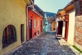 Unidentified tourists walking in historic town Sighisoara. City in which was born Vlad Tepes, Royalty Free Stock Photo