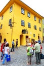 Unidentified tourists walking in historic town Sighisoara on July 17, 2014. Royalty Free Stock Photo