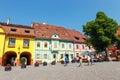 Unidentified tourists walking in historic town Sighisoara. Royalty Free Stock Photo