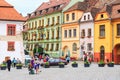 Unidentified tourists walking in historic town Sighisoara Royalty Free Stock Photo