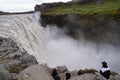 Unidentified tourists watching Dettifoss closely in Iceland.