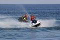 Unidentified Turkish men compete with each other on water scoote