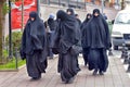 Unidentified Turkish women in traditional Islamic clothing on the streets of the city Royalty Free Stock Photo