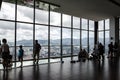 Unidentified visitors exploring the Observatory Deck with transparent glass floor at level 68 on roof top of Komtar Tower, Penang.