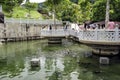 Unidentified visitors are feeding turtles at Kek Lok Si temple Turtle Liberation Pond. Penang, Malaysia Royalty Free Stock Photo