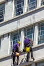 Unidentified Washers Wash The Windows Of Old Building In Central London. UK