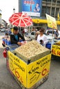 Unidentified Woman buying pumpkin seeds