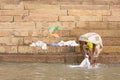 Unidentified woman doing laundry banks of the Ganges river Royalty Free Stock Photo