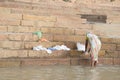 Unidentified woman doing laundry banks of the Ganges river Royalty Free Stock Photo