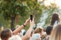 Unidentified woman filming scene by mobile phone during a concert dedicated Moscow city day on September 9, 2019 Royalty Free Stock Photo