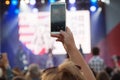 Unidentified woman filming scene by mobile phone during a concert dedicated Moscow city day on September 9, 2019