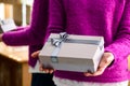 Unidentified woman holding a small gift. Concept of celebration Royalty Free Stock Photo