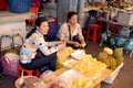 Unidentified woman peeling durian fruit