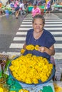 Unidentified woman sells flowers at the flower market Pak Klong Thalat early morning