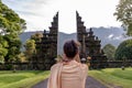 Unidentified woman at the traditional gate in Bali