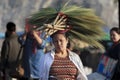 Unidentified women with Brooms grass flower on her head.