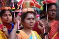 Women devotees carry scared pots in their heads and participates in the Thaipusam festival