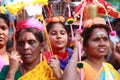 Women devotees carry scared pots in their heads and participates in the Thaipusam festival