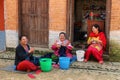 Unidentified women sewing in the street in Panauti, Nepal