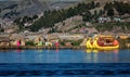 Unidentified women welcome tourist on the lake Titicaca in Puno, Peru