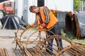 Unidentified workers working with concrete iron at a construction site