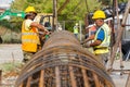 Unidentified workers working with concrete iron at a construction site