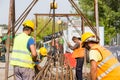 Unidentified workers working with concrete iron at a construction site