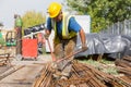 Unidentified workers working with concrete iron at a construction site