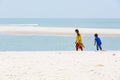 Unidentified young women girl couple taking a walk at beautiful sunny morning at Danushkodi beach