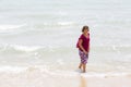 Unidentified young women girl couple taking a walk at beautiful sunny morning at Danushkodi beach