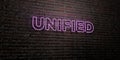 UNIFIED -Realistic Neon Sign on Brick Wall background - 3D rendered royalty free stock image