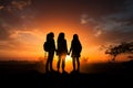Unified strength, Silhouetted young women convey solidarity, forging unbreakable bond