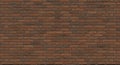 A uniform brick wall with reddish-brown bricks arranged in a horizontal pattern. The Royalty Free Stock Photo