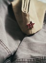 Uniform cap of a Soviet soldier of the WWII with a star. In memory of Victory Day on May 9th. Royalty Free Stock Photo