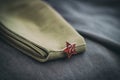 Uniform cap of a Soviet soldier of the WWII with a star. In memory of Victory Day on May 9th. Royalty Free Stock Photo