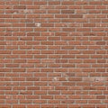 Uniform red brick wall with a classic running bond pattern. Each brick is rectangular Royalty Free Stock Photo